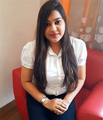 a woman sitting on a red chair